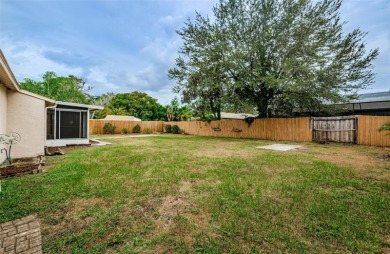 AFFORDABLE HOME IN THE HEART OF SPRING HILL ~ Welcome to this on Oak Hills Country Club in Florida - for sale on GolfHomes.com, golf home, golf lot