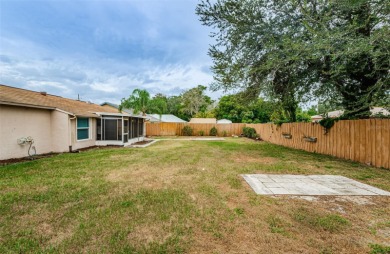 AFFORDABLE HOME IN THE HEART OF SPRING HILL ~ Welcome to this on Oak Hills Country Club in Florida - for sale on GolfHomes.com, golf home, golf lot