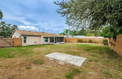 AFFORDABLE HOME IN THE HEART OF SPRING HILL ~ Welcome to this on Oak Hills Country Club in Florida - for sale on GolfHomes.com, golf home, golf lot