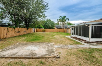 AFFORDABLE HOME IN THE HEART OF SPRING HILL ~ Welcome to this on Oak Hills Country Club in Florida - for sale on GolfHomes.com, golf home, golf lot