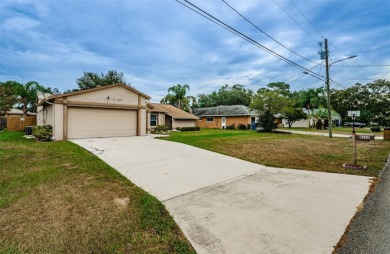 AFFORDABLE HOME IN THE HEART OF SPRING HILL ~ Welcome to this on Oak Hills Country Club in Florida - for sale on GolfHomes.com, golf home, golf lot