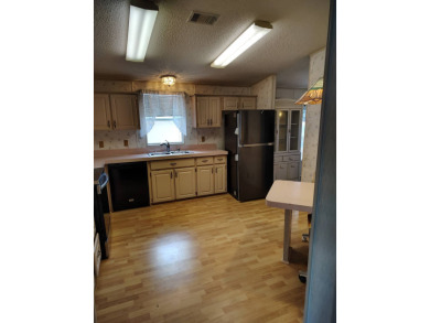 This home is priced to sell for the amount of square footage you on Spanish Lakes Fairways in Florida - for sale on GolfHomes.com, golf home, golf lot