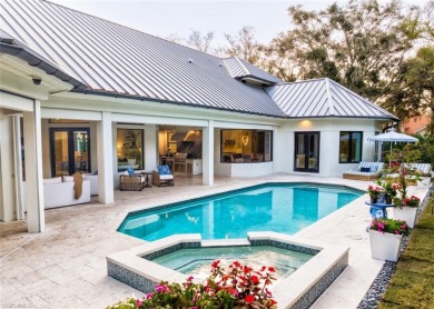 Introducing a luxurious retreat nestled within the prestigious on Club at Pelican Bay Golf Course in Florida - for sale on GolfHomes.com, golf home, golf lot