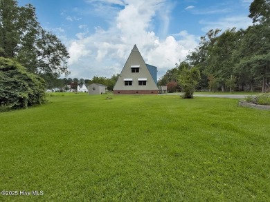 Welcome to 211 Country Club Road--a one-of-a-kind A-frame on Rock Creek Country Club in North Carolina - for sale on GolfHomes.com, golf home, golf lot