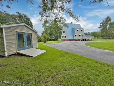 Welcome to 211 Country Club Road--a one-of-a-kind A-frame on Rock Creek Country Club in North Carolina - for sale on GolfHomes.com, golf home, golf lot