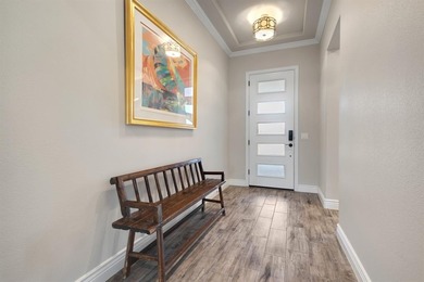 This stunning, light-filled home showcases an open-concept on Wildhorse Golf Club of Robson Ranch in Texas - for sale on GolfHomes.com, golf home, golf lot