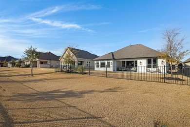 This stunning, light-filled home showcases an open-concept on Wildhorse Golf Club of Robson Ranch in Texas - for sale on GolfHomes.com, golf home, golf lot