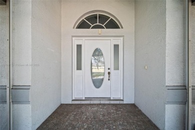 Located on a large corner lot along a peaceful canal, this on Spring Lake Golf Resort in Florida - for sale on GolfHomes.com, golf home, golf lot