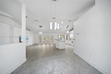 Located on a large corner lot along a peaceful canal, this on Spring Lake Golf Resort in Florida - for sale on GolfHomes.com, golf home, golf lot