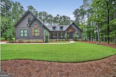 Experience elegance and privacy in this immaculate 4-bedroom, 3 on Harbor Club Golf and Country Club in Georgia - for sale on GolfHomes.com, golf home, golf lot