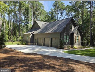 Experience elegance and privacy in this immaculate 4-bedroom, 3 on Harbor Club Golf and Country Club in Georgia - for sale on GolfHomes.com, golf home, golf lot