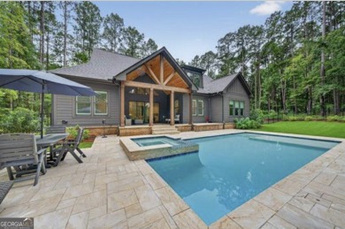 Experience elegance and privacy in this immaculate 4-bedroom, 3 on Harbor Club Golf and Country Club in Georgia - for sale on GolfHomes.com, golf home, golf lot