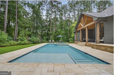 Experience elegance and privacy in this immaculate 4-bedroom, 3 on Harbor Club Golf and Country Club in Georgia - for sale on GolfHomes.com, golf home, golf lot