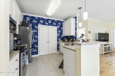 A stunning first floor condo in the Osprey Creek section of Sea on Sea Trail Golf Resort in North Carolina - for sale on GolfHomes.com, golf home, golf lot