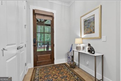 Experience elegance and privacy in this immaculate 4-bedroom, 3 on Harbor Club Golf and Country Club in Georgia - for sale on GolfHomes.com, golf home, golf lot