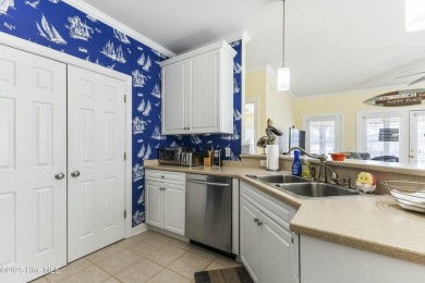 A stunning first floor condo in the Osprey Creek section of Sea on Sea Trail Golf Resort in North Carolina - for sale on GolfHomes.com, golf home, golf lot