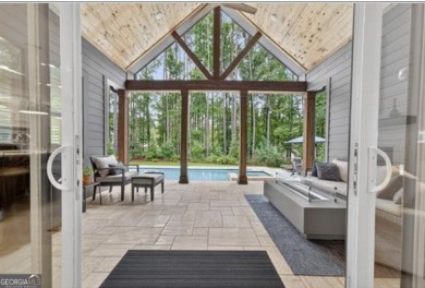 Experience elegance and privacy in this immaculate 4-bedroom, 3 on Harbor Club Golf and Country Club in Georgia - for sale on GolfHomes.com, golf home, golf lot