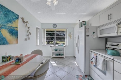 This spacious 3/2 condo in Cypress at Woodmont, offering 1,792 on Woodmont Country Club in Florida - for sale on GolfHomes.com, golf home, golf lot
