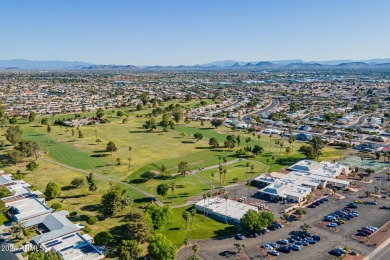 This updated and beautiful 3-bedroom home is move in ready with on Sun City Lakes West and East in Arizona - for sale on GolfHomes.com, golf home, golf lot