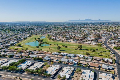 This updated and beautiful 3-bedroom home is move in ready with on Sun City Lakes West and East in Arizona - for sale on GolfHomes.com, golf home, golf lot