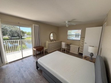 VIEW! VIEW! VIEW! Beautiful waterfront unit! Spacious, Partially on Kings Point Golf -Flanders Way in Florida - for sale on GolfHomes.com, golf home, golf lot