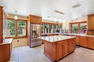 Stately Mid Century Modern 4-bedroom home situated on a wooded on Covington Country Club in Louisiana - for sale on GolfHomes.com, golf home, golf lot