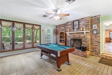 Stately Mid Century Modern 4-bedroom home situated on a wooded on Covington Country Club in Louisiana - for sale on GolfHomes.com, golf home, golf lot