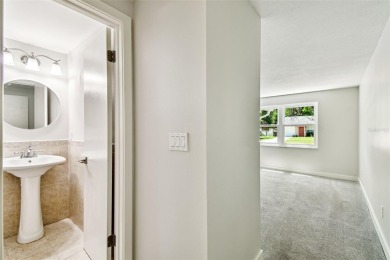 Welcome to this beautifully updated 3-bedroom, 2-bathroom block on Northdale Golf and Tennis Club in Florida - for sale on GolfHomes.com, golf home, golf lot