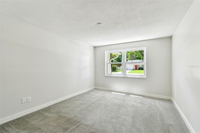 Welcome to this beautifully updated 3-bedroom, 2-bathroom block on Northdale Golf and Tennis Club in Florida - for sale on GolfHomes.com, golf home, golf lot