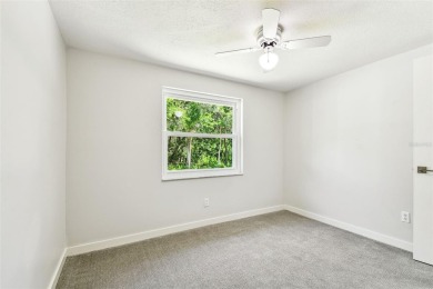 Welcome to this beautifully updated 3-bedroom, 2-bathroom block on Northdale Golf and Tennis Club in Florida - for sale on GolfHomes.com, golf home, golf lot