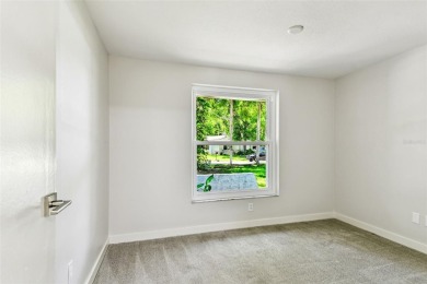 Welcome to this beautifully updated 3-bedroom, 2-bathroom block on Northdale Golf and Tennis Club in Florida - for sale on GolfHomes.com, golf home, golf lot