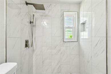 Welcome to this beautifully updated 3-bedroom, 2-bathroom block on Northdale Golf and Tennis Club in Florida - for sale on GolfHomes.com, golf home, golf lot