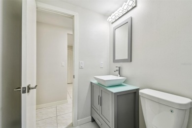 Welcome to this beautifully updated 3-bedroom, 2-bathroom block on Northdale Golf and Tennis Club in Florida - for sale on GolfHomes.com, golf home, golf lot