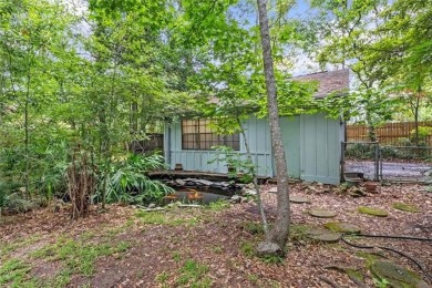 Stately Mid Century Modern 4-bedroom home situated on a wooded on Covington Country Club in Louisiana - for sale on GolfHomes.com, golf home, golf lot