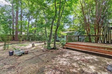 Stately Mid Century Modern 4-bedroom home situated on a wooded on Covington Country Club in Louisiana - for sale on GolfHomes.com, golf home, golf lot
