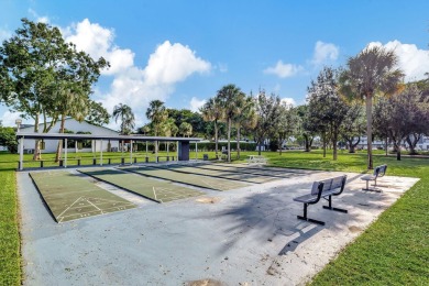 Exceptional unit, fully renovated with great lake and golf views on Oriole Golf and Tennis Club in Florida - for sale on GolfHomes.com, golf home, golf lot