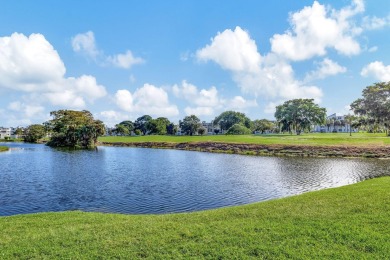 Exceptional unit, fully renovated with great lake and golf views on Oriole Golf and Tennis Club in Florida - for sale on GolfHomes.com, golf home, golf lot