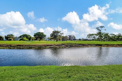 Exceptional unit, fully renovated with great lake and golf views on Oriole Golf and Tennis Club in Florida - for sale on GolfHomes.com, golf home, golf lot