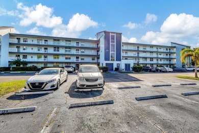 Exceptional unit, fully renovated with great lake and golf views on Oriole Golf and Tennis Club in Florida - for sale on GolfHomes.com, golf home, golf lot