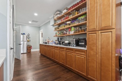 Perfectly positioned on a sprawling 0.76-acre lot overlooking on Myrtlewood Golf Course and Club  in South Carolina - for sale on GolfHomes.com, golf home, golf lot