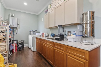 Perfectly positioned on a sprawling 0.76-acre lot overlooking on Myrtlewood Golf Course and Club  in South Carolina - for sale on GolfHomes.com, golf home, golf lot