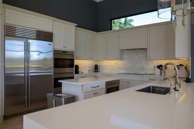 Luxury residence with panoramic golf views in the exclusive on Weston Hills Country Club in Florida - for sale on GolfHomes.com, golf home, golf lot