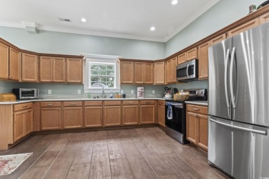 Perfectly positioned on a sprawling 0.76-acre lot overlooking on Myrtlewood Golf Course and Club  in South Carolina - for sale on GolfHomes.com, golf home, golf lot