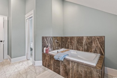 Perfectly positioned on a sprawling 0.76-acre lot overlooking on Myrtlewood Golf Course and Club  in South Carolina - for sale on GolfHomes.com, golf home, golf lot