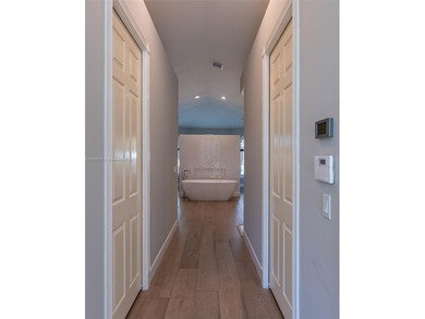 Luxury residence with panoramic golf views in the exclusive on Weston Hills Country Club in Florida - for sale on GolfHomes.com, golf home, golf lot