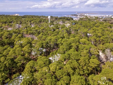 Are you looking for a Gold Fortified home nestled away in *The on Isle Dauphine Club Golf Course in Alabama - for sale on GolfHomes.com, golf home, golf lot