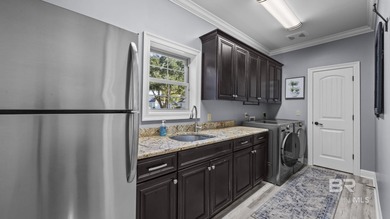 Elevate your vision of paradise in this stunning, 4BR/4BA on Peninsula Golf and Racquet Club in Alabama - for sale on GolfHomes.com, golf home, golf lot