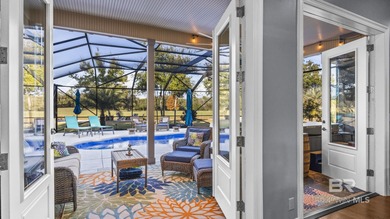 Elevate your vision of paradise in this stunning, 4BR/4BA on Peninsula Golf and Racquet Club in Alabama - for sale on GolfHomes.com, golf home, golf lot