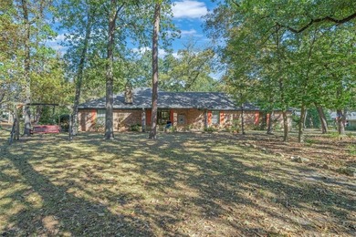 Fantastic curb appeal on this 3BD-2BA brick home in Holly Lake on Holly Lake Ranch Golf Club in Texas - for sale on GolfHomes.com, golf home, golf lot