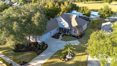 Elevate your vision of paradise in this stunning, 4BR/4BA on Peninsula Golf and Racquet Club in Alabama - for sale on GolfHomes.com, golf home, golf lot